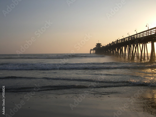 sun setting on the pier