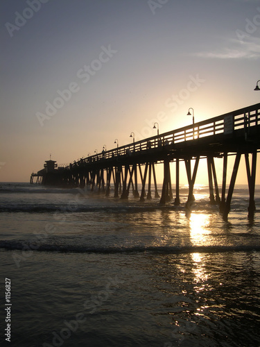 sun setting on the pier vertical