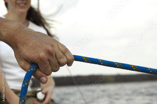 pulling the rope while sailing photo