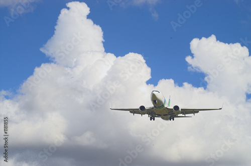 airplane in a blue and white sky