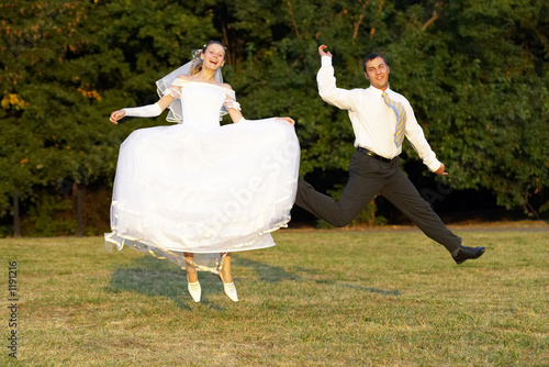 happy wedding couple - jump