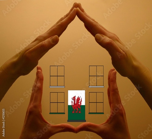 hands holding welsh house
