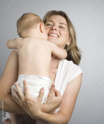 mother cuddling with her son