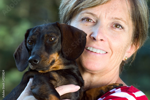smiling woman and small dog