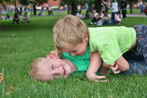 children play in grass © Pavel Losevsky