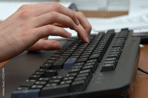 hands above a keyboard