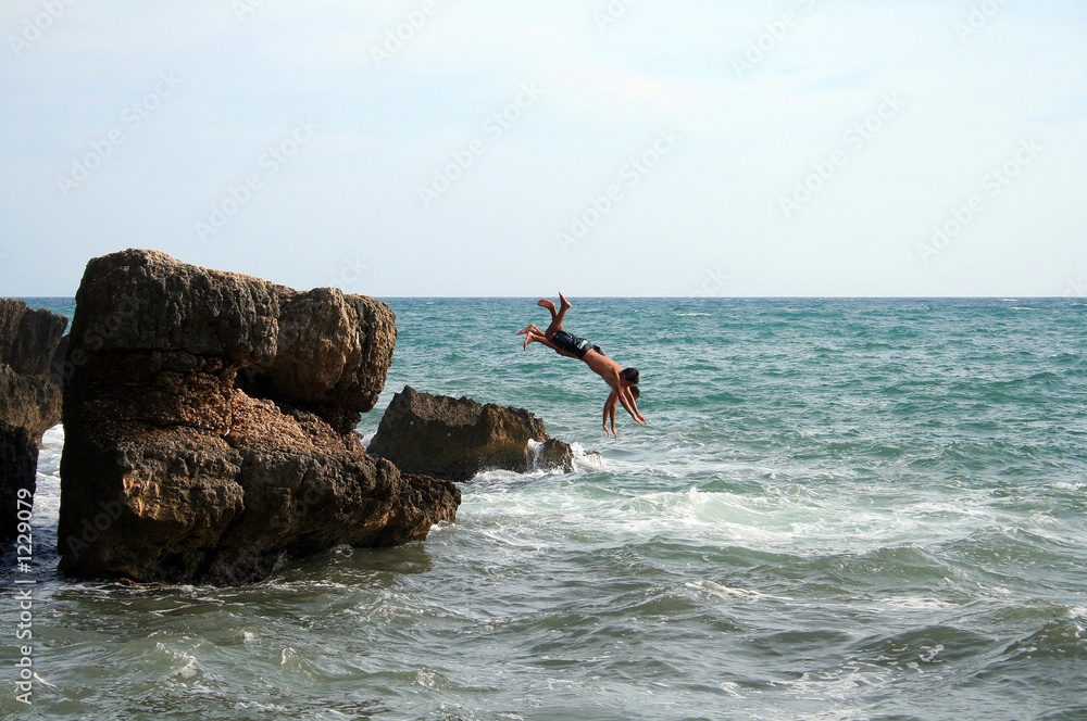 two men jumping into the water