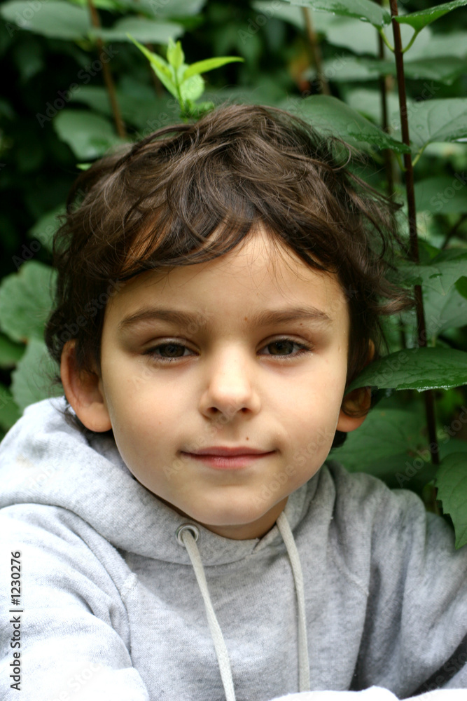 the boy in a garden. the boy in a garden.