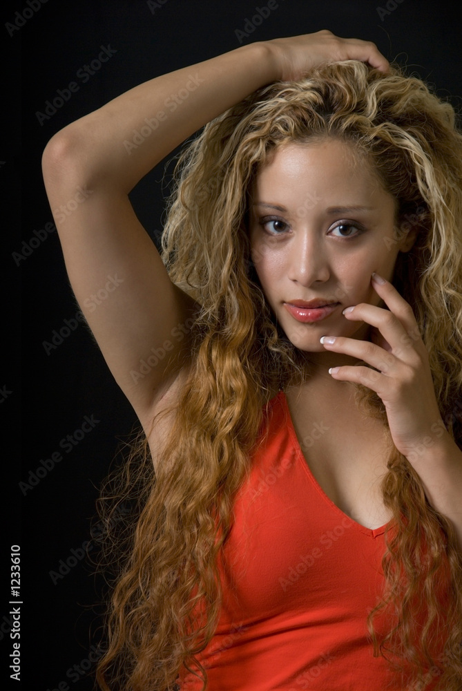 pretty blond woman with hand on head on chin