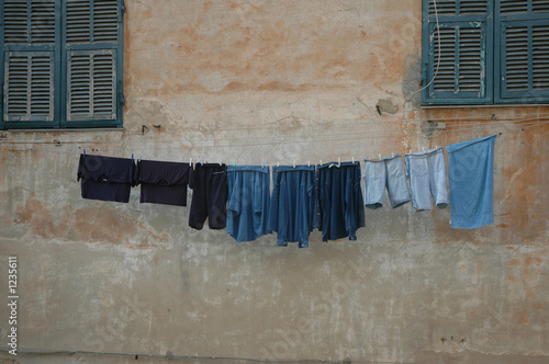 clothes on a wall © Carlo Panzi