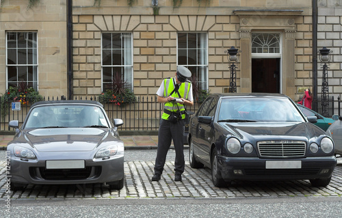Fototapeta parking attendant, traffic warden, getting ticket