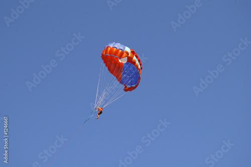 paraglider on the blue sky. photo