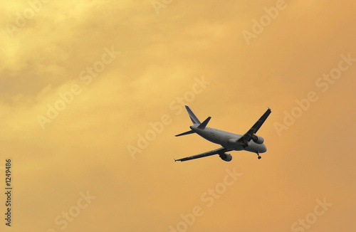 landing flight on sunset light