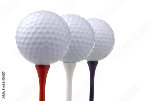 golf balls on red, white & blue tees
