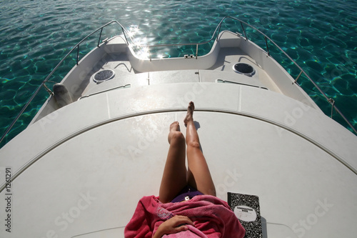 woman lying on a boat photo