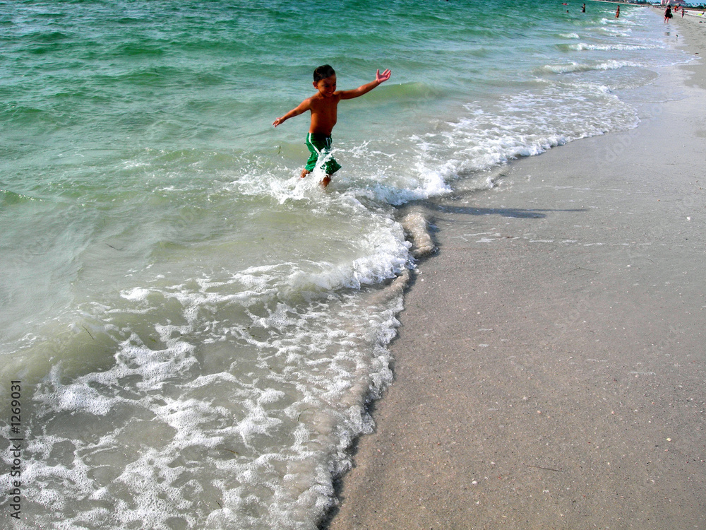 boy playing on beach