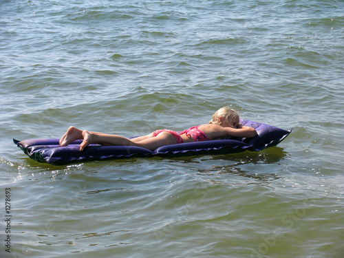 girl on the swimming mattress photo