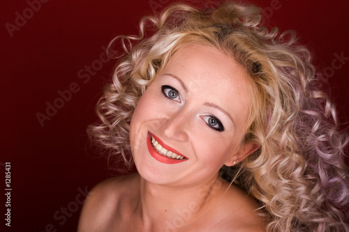 beautiful woman with curly hair laughing