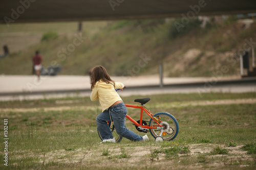 girl push a bicycle
