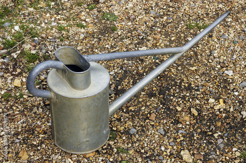 watering can on gravel