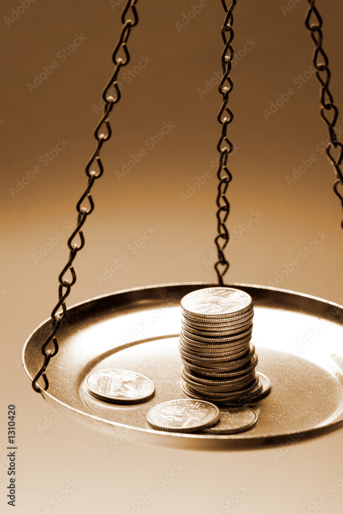 money on a balance scale money on a balance scale