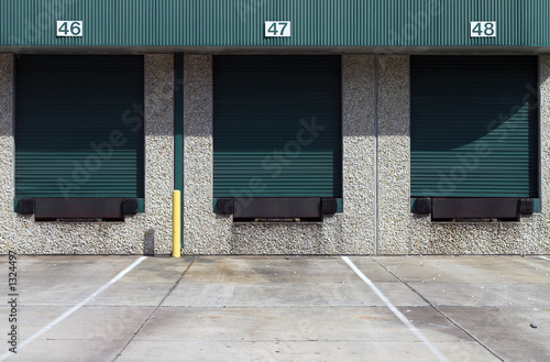 three green warehouse loading bays