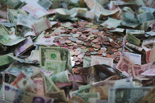 big pile of mixed currency
