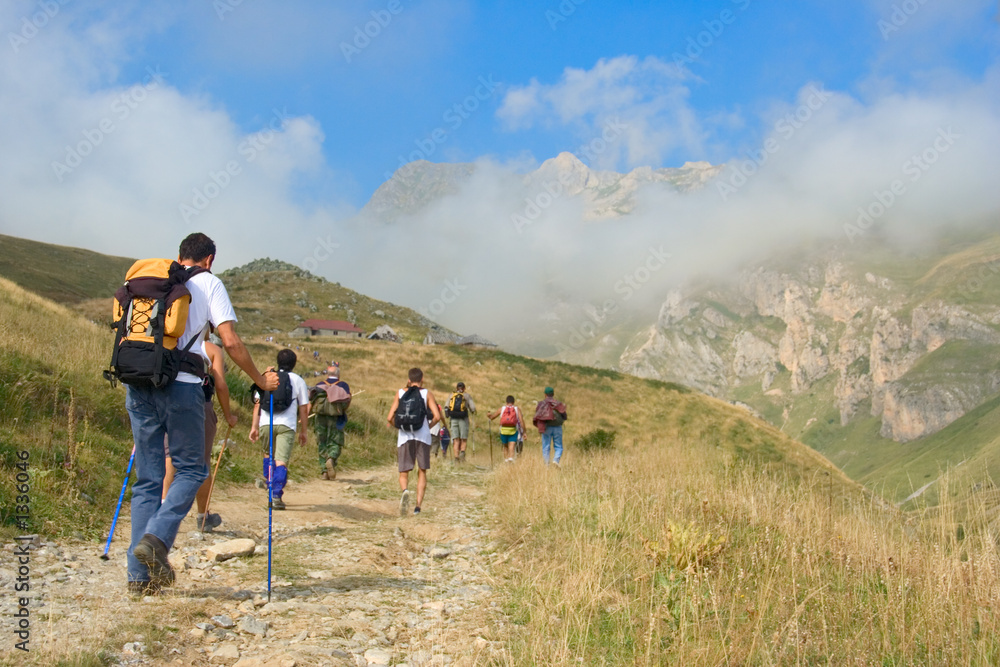 people hiking in the mountain korab