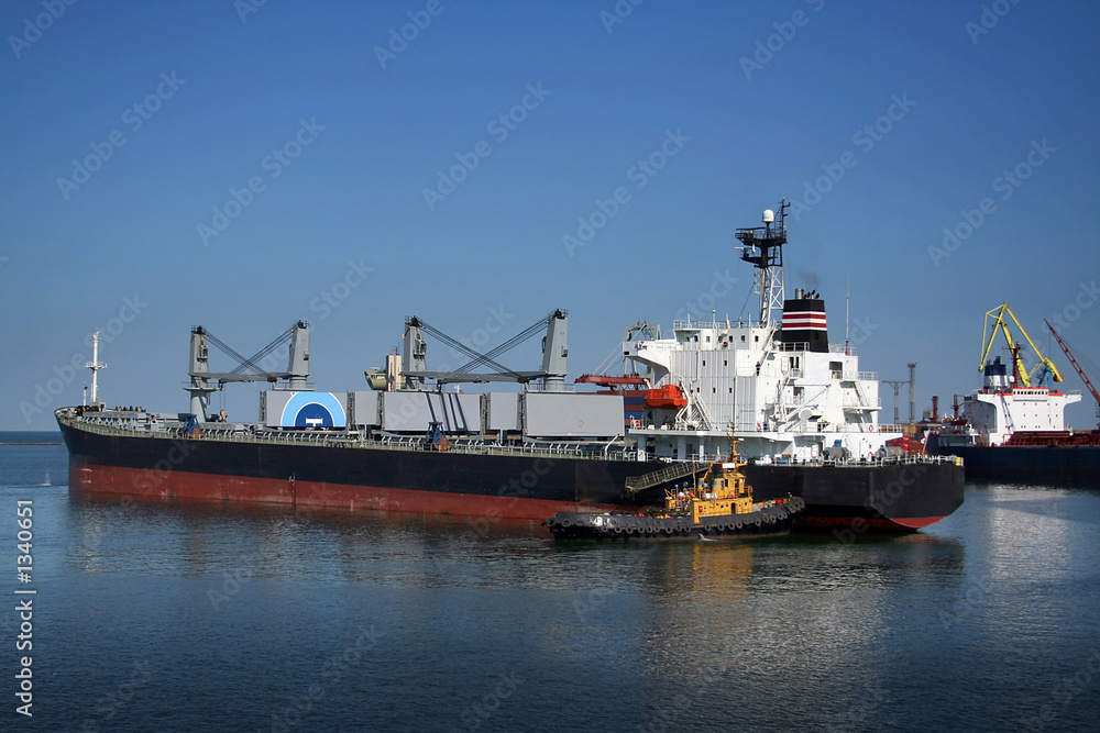 the ship and  tugboat