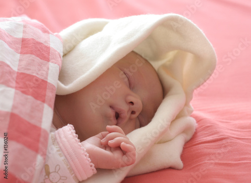baby sleeping in red