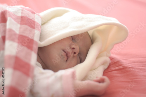 baby sleeping in red photo
