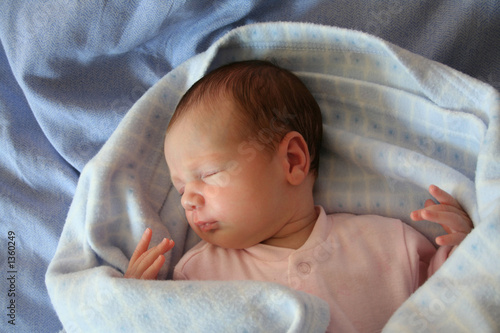 baby sleeping in blue photo