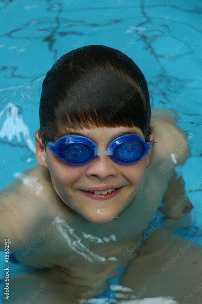 boy swimming with goggles