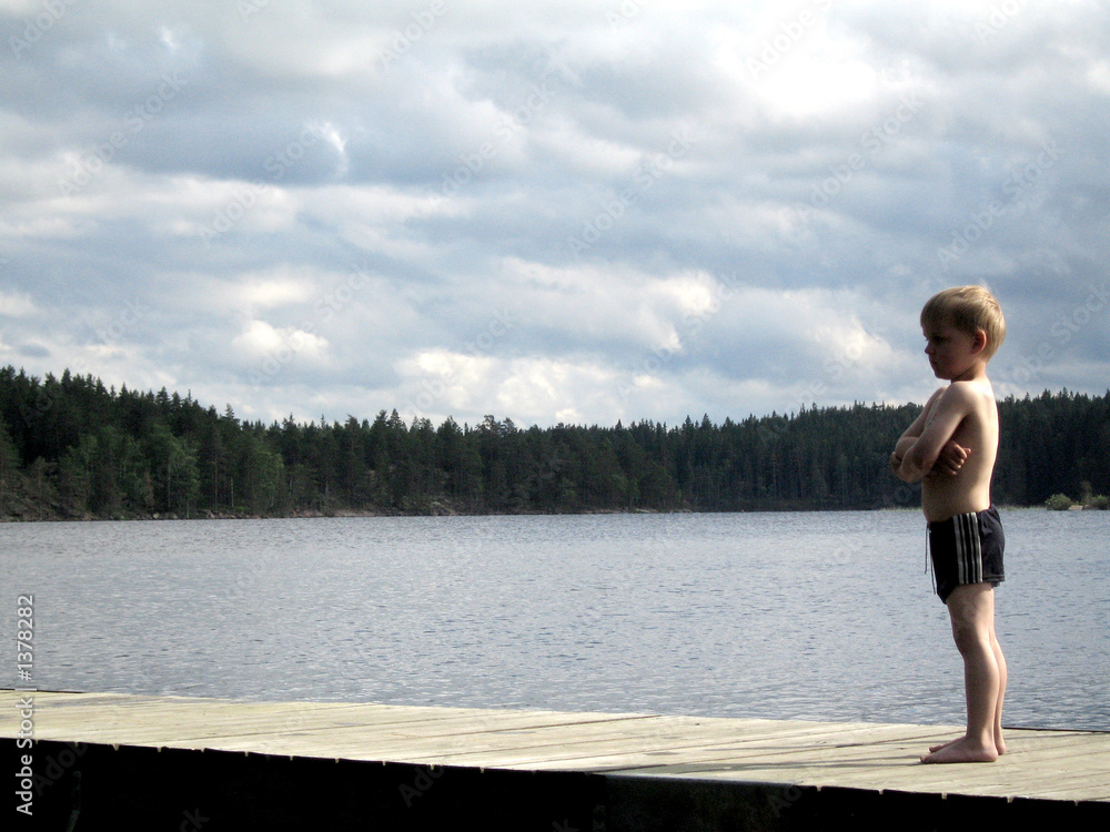 kid by lake