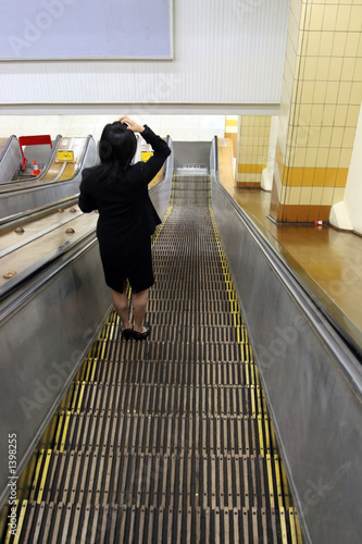 woman in escalator photo