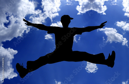 jumping boy - blue sky photo