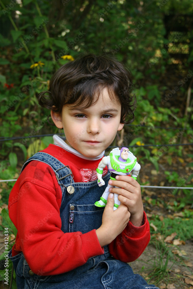 the boy in a garden. the boy in a garden.