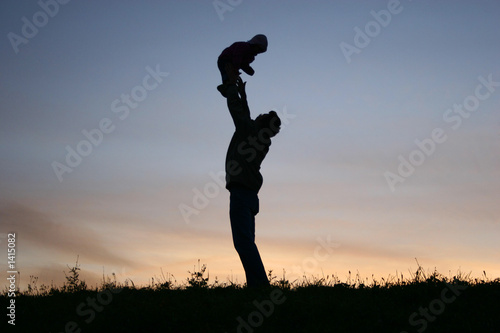 silhouette father with baby