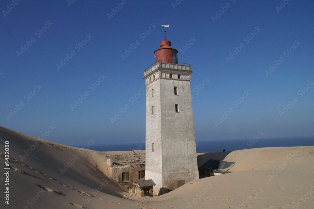 leuchtturm hinter der düne