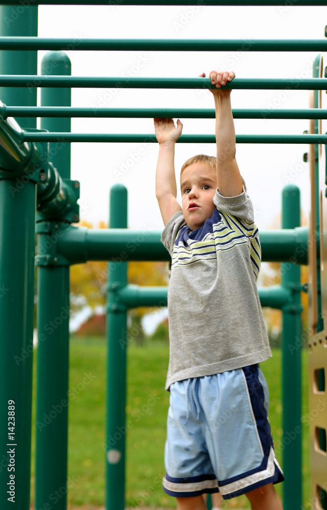 Fototapeta premium boy on monkey bars
