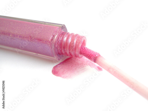 opened pink gloss for lips on white background photo