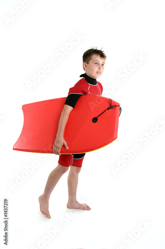 surfer boy holding a bodyboard photo