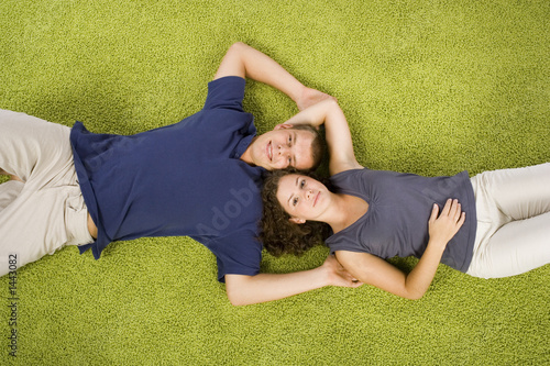young couple on green carpet