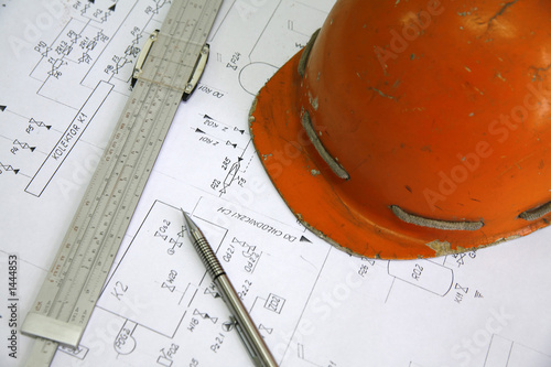 pencil, calliper and helmet