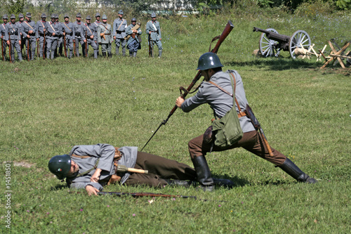 soldiers in attack position simulating a kill action