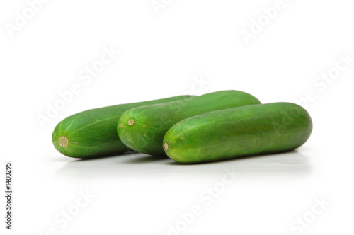 three cucumbers isolated on white