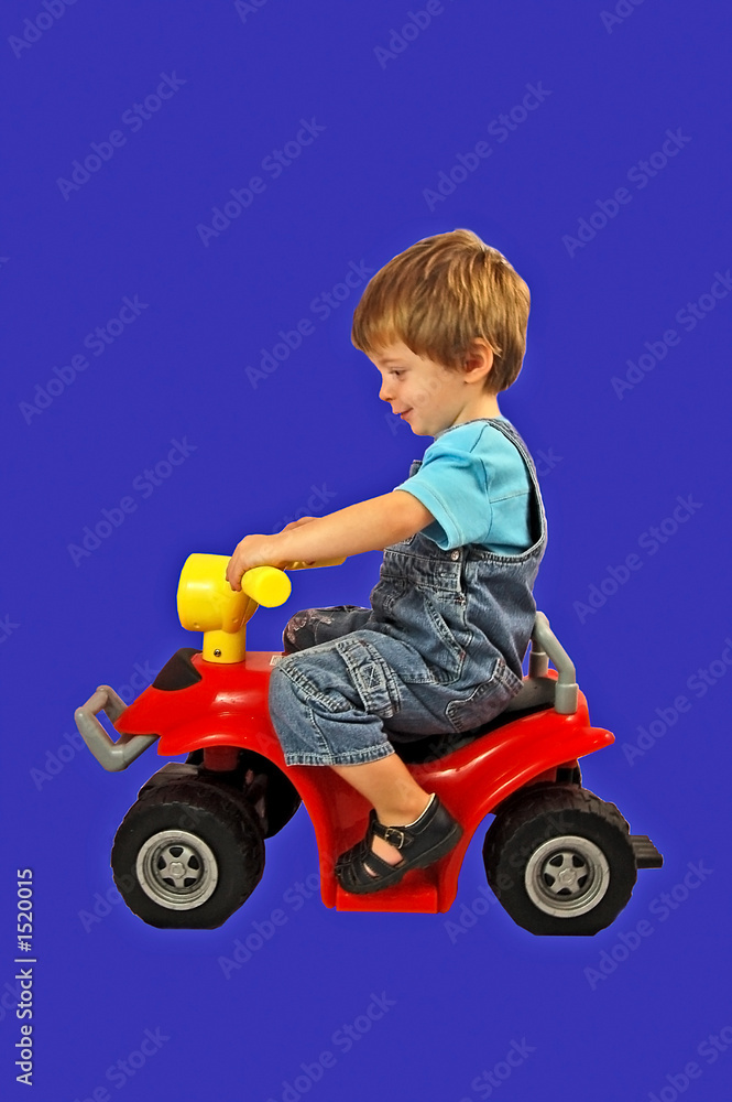 little boy on a toy bike little boy on a toy bike
