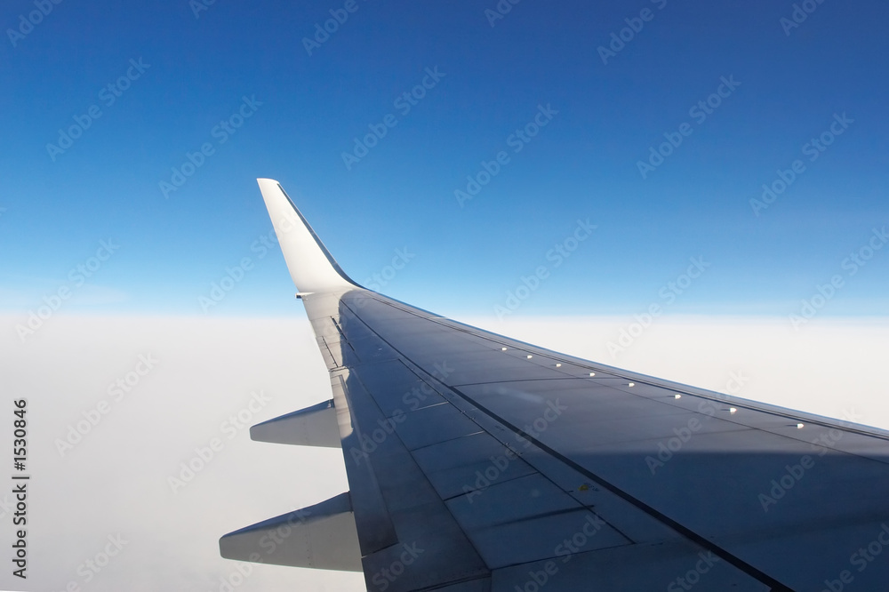 airplane wing above the clouds airplane wing above the clouds