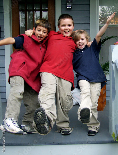 three kids kicking