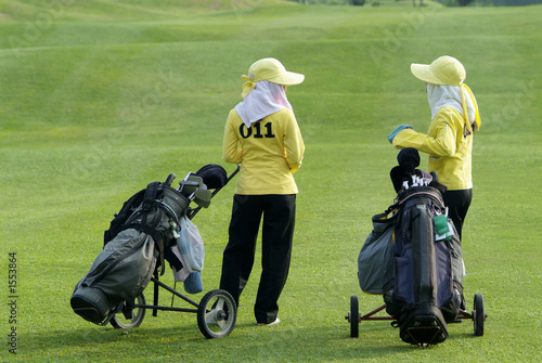 two caddies at a golf course